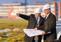 Image of two property men in hard hats.