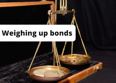 Some weighing scales with the caption: weighing up bonds