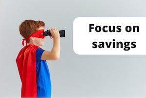 Super hero with binoculars to illustrate focusing on your savings rate